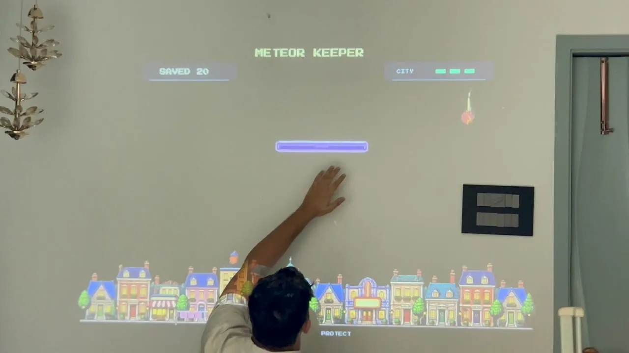 Playing Meteor Keeper on a wall with hand tracking in Playfield